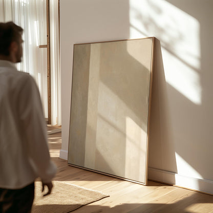 Vertical bands of light and shadow on warm beige, canvas print presented in a light, minimal room
