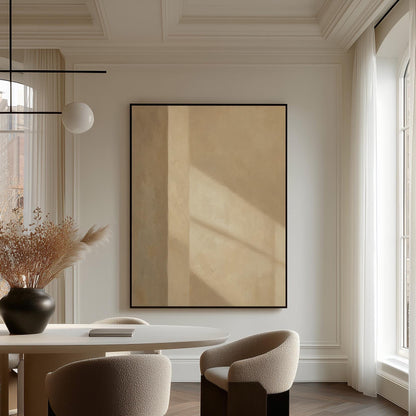 Vertical bands of light and shadow on warm beige, canvas print displayed on a neutral wall in a styled interior