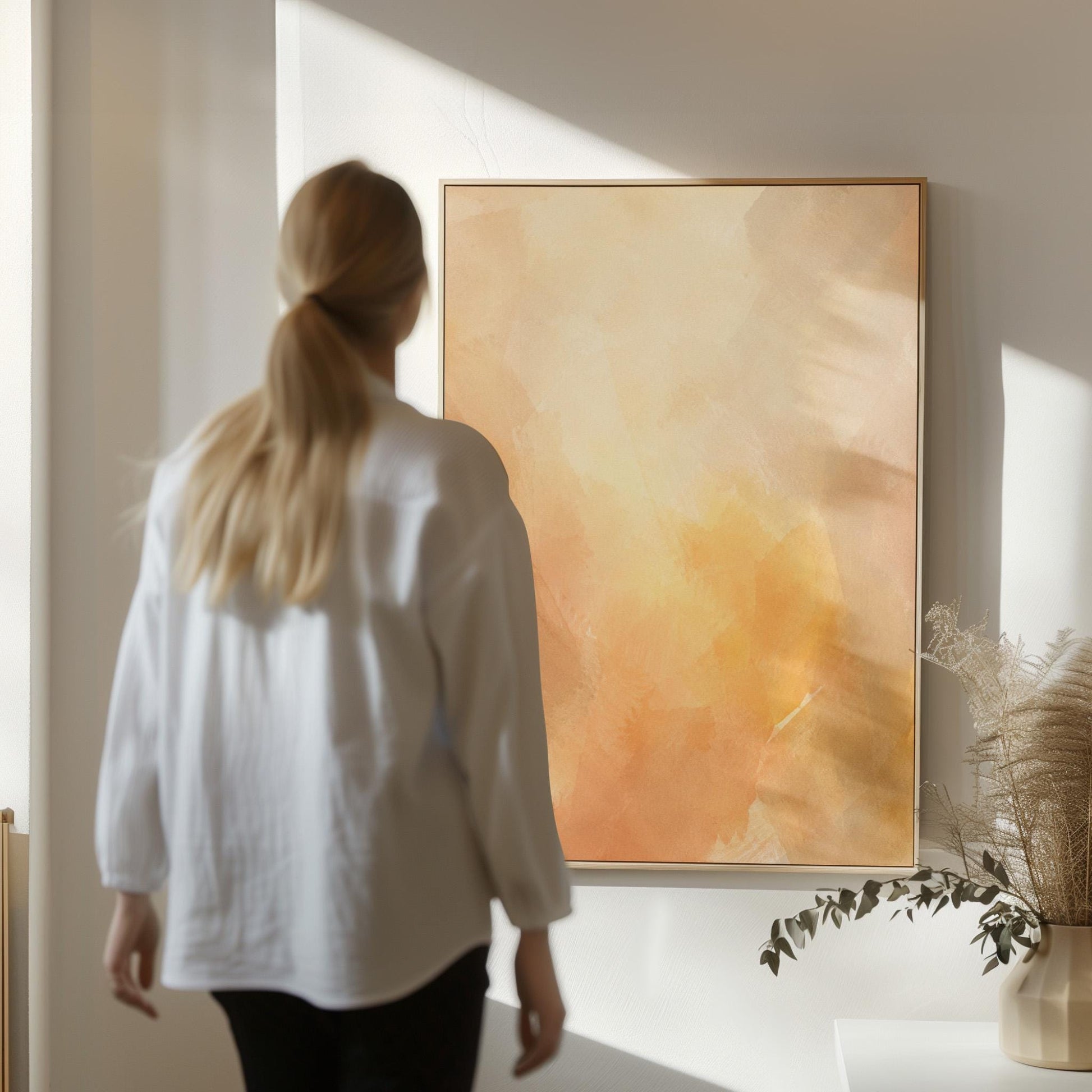 Radiant golden peach glow like hazy sunrise, canvas wall art hanging in a calm, modern living space