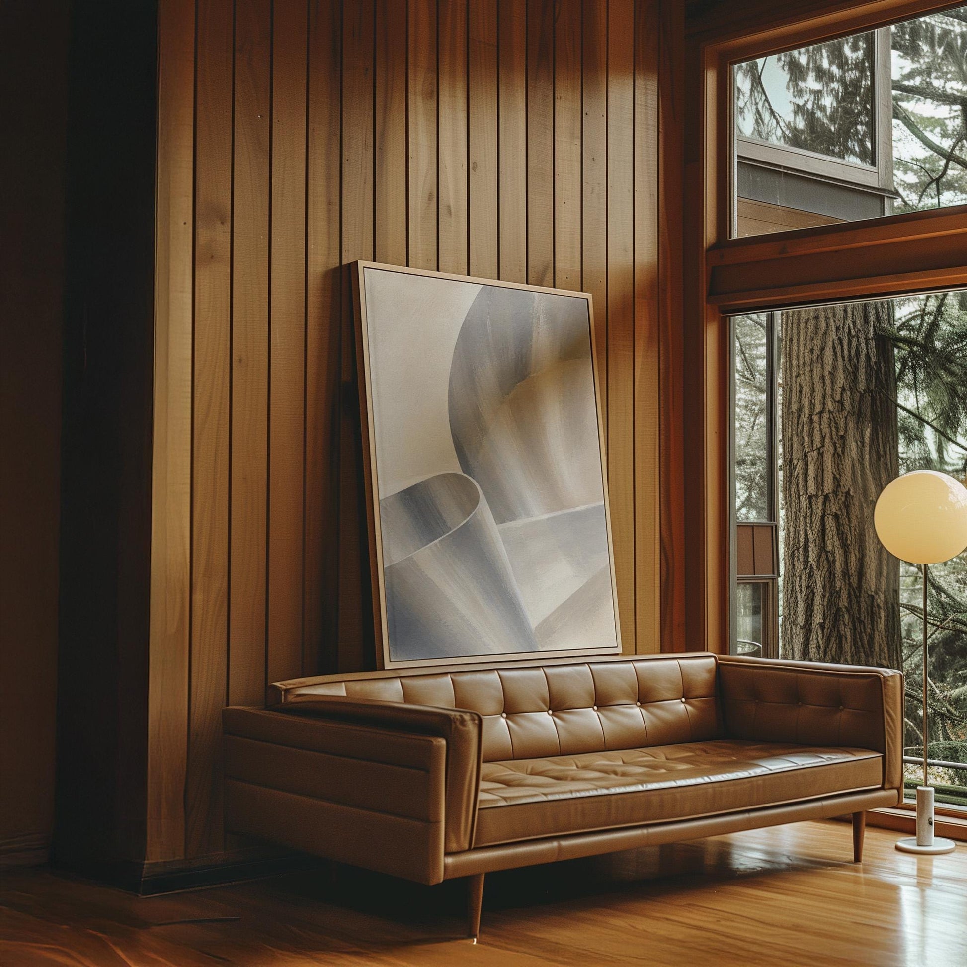 Graceful ribbon curves in silver and pale blue, canvas print hanging in a calm, modern living space