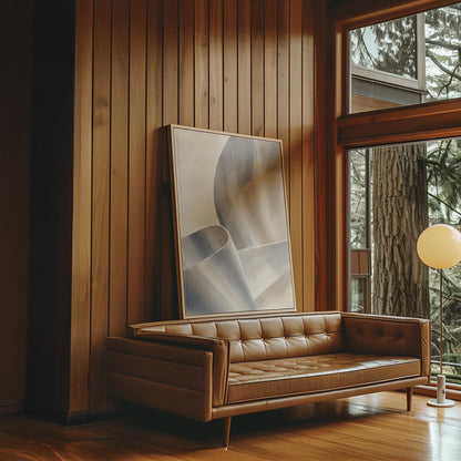 Graceful ribbon curves in silver and pale blue, canvas print hanging in a calm, modern living space