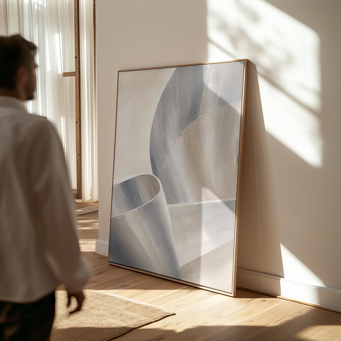 Graceful ribbon curves in silver and pale blue, canvas print shown to scale in a furnished room