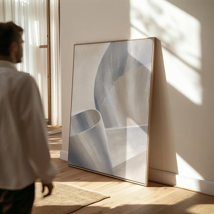 Graceful ribbon curves in silver and pale blue, canvas print shown to scale in a furnished room