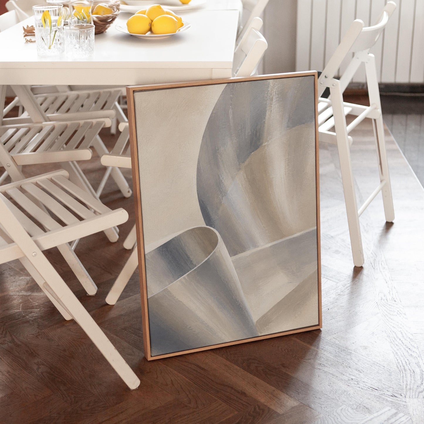 Graceful ribbon curves in silver and pale blue, canvas wall art seen in a warm interior with natural light