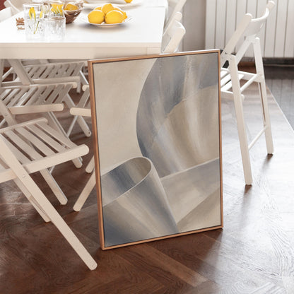 Graceful ribbon curves in silver and pale blue, canvas wall art seen in a warm interior with natural light