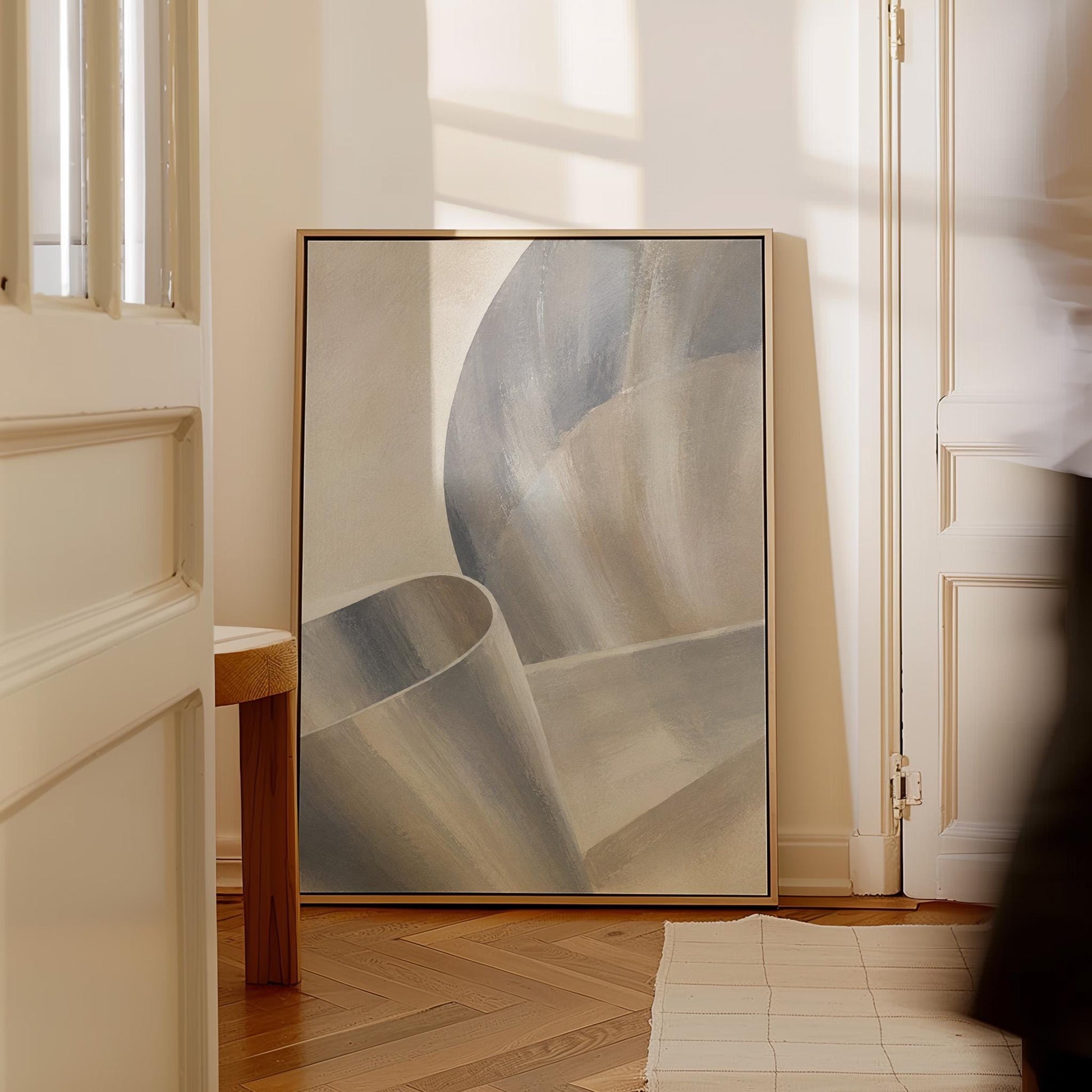 Graceful ribbon curves in silver and pale blue, canvas wall art presented in a light, minimal room