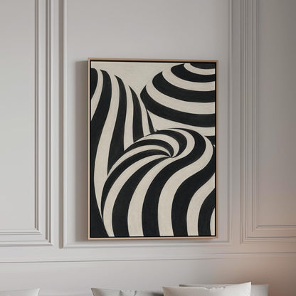 Swirling black and white striped forms, canvas print in a bright room with natural daylight