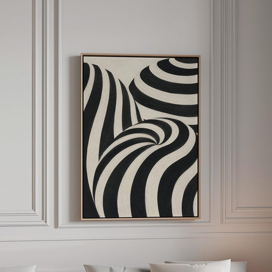 Swirling black and white striped forms, canvas print in a bright room with natural daylight