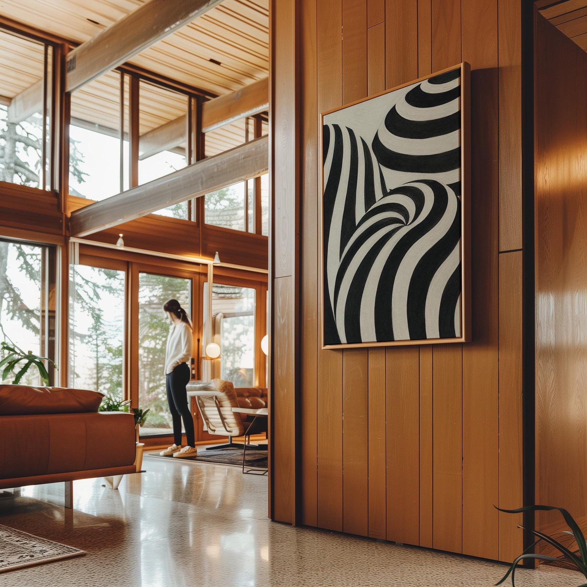 Swirling black and white striped forms, canvas print hanging in a calm, modern living space
