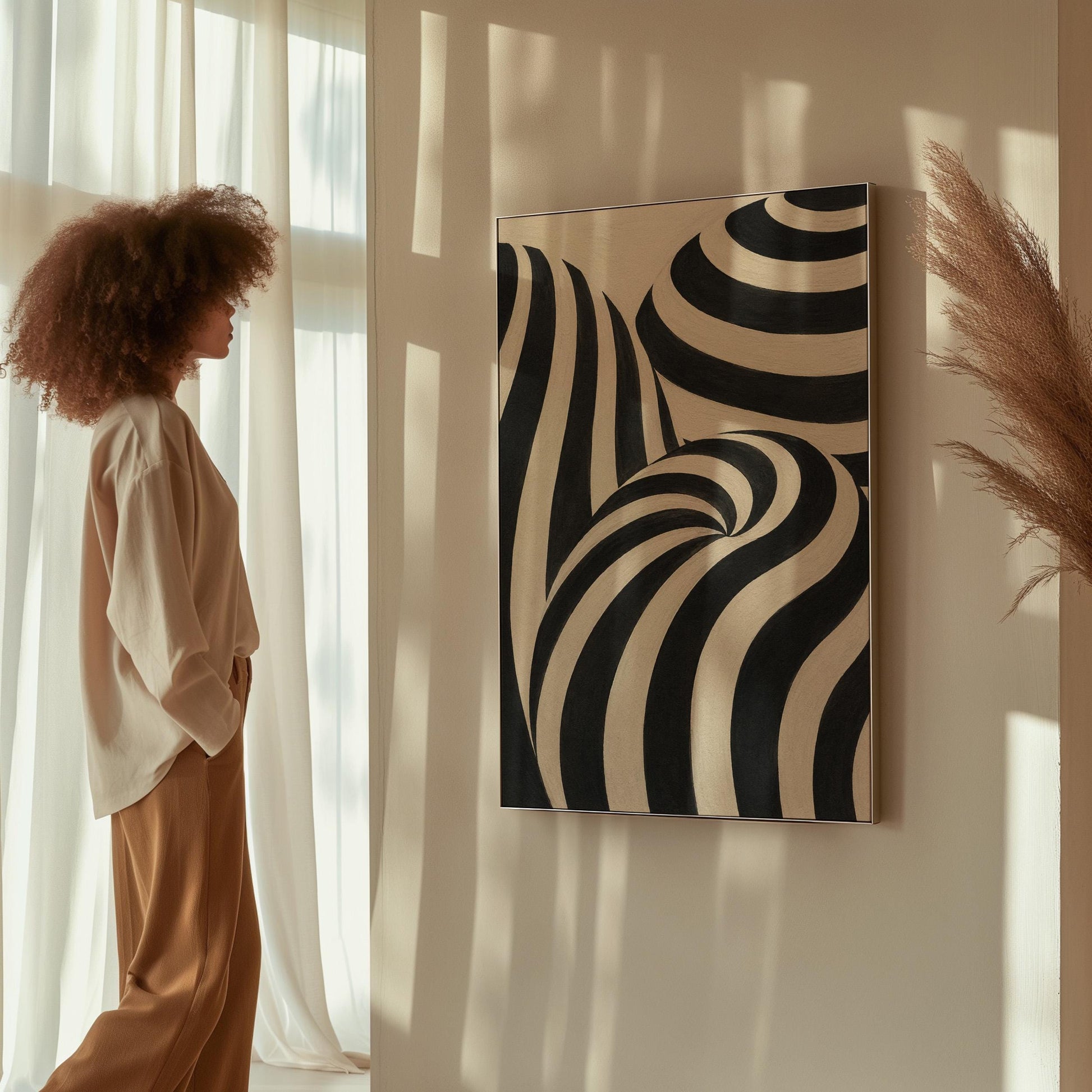 Swirling black and white striped forms, canvas wall art styled against a soft white wall