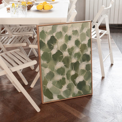 Cactus pads pattern with pale spines in sage green, canvas print seen in a warm interior with natural light