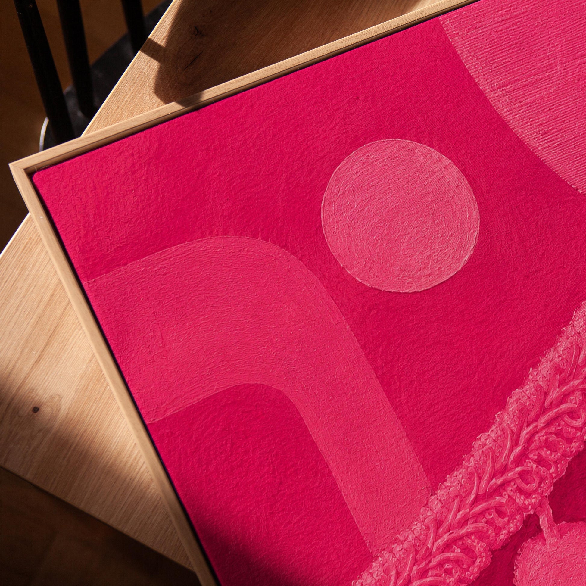 Hot magenta composition with arches and pom pom garland, canvas print in a warm, minimally styled interior