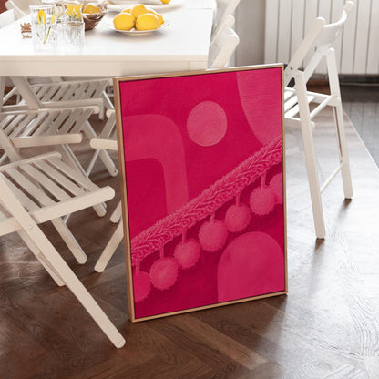 Hot magenta composition with arches and pom pom garland, canvas wall art seen in a warm interior with natural light