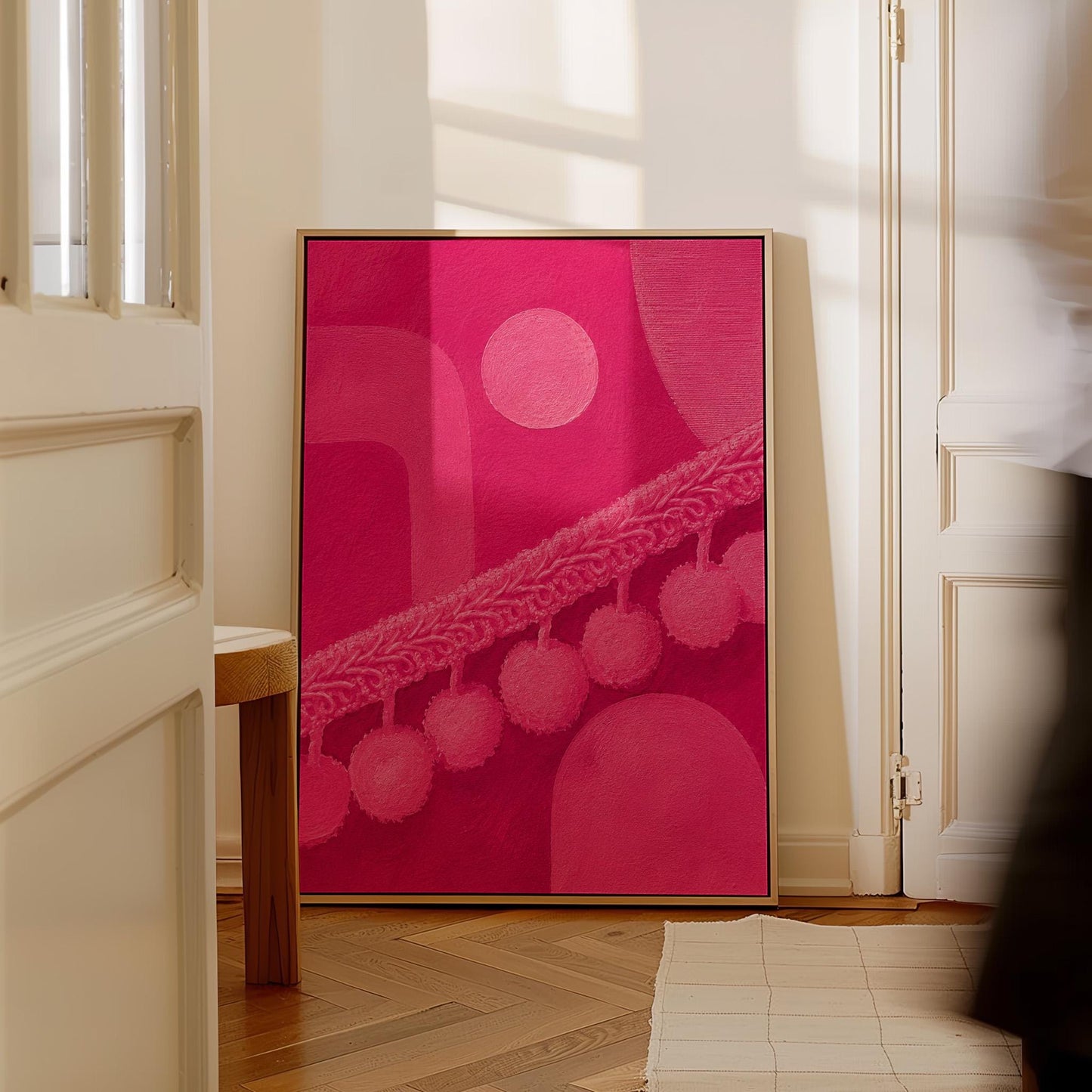 Hot magenta composition with arches and pom pom garland, canvas wall art presented in a light, minimal room