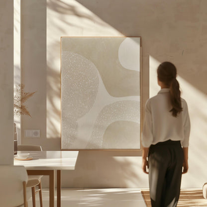 Soft speckled organic shapes in pearl and cream, canvas print shown in a sunlit, contemporary room