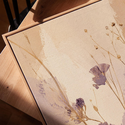 Delicate wildflowers and lavender stems on warm beige, canvas print in a warm, minimally styled interior