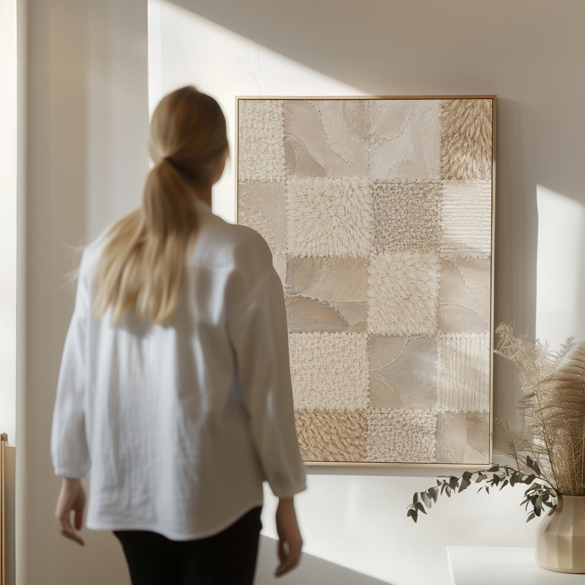 Checkered patchwork of soft cream and beige squares, canvas print presented in a light, minimal room