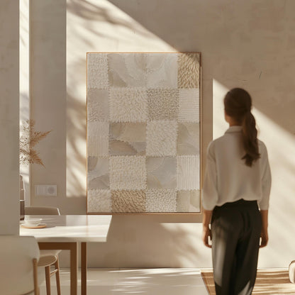 Checkered patchwork of soft cream and beige squares, canvas print displayed on a neutral wall in a styled interior