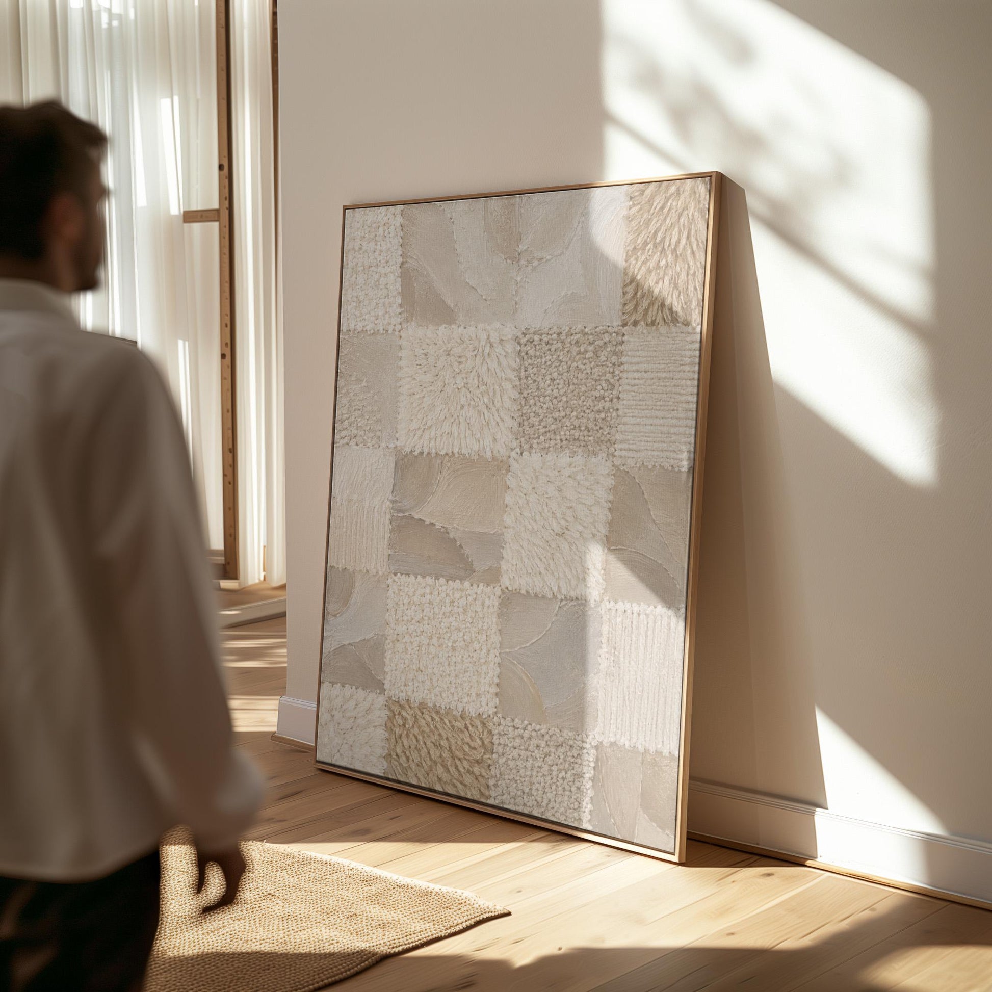 Checkered patchwork of soft cream and beige squares, canvas wall art presented in a light, minimal room