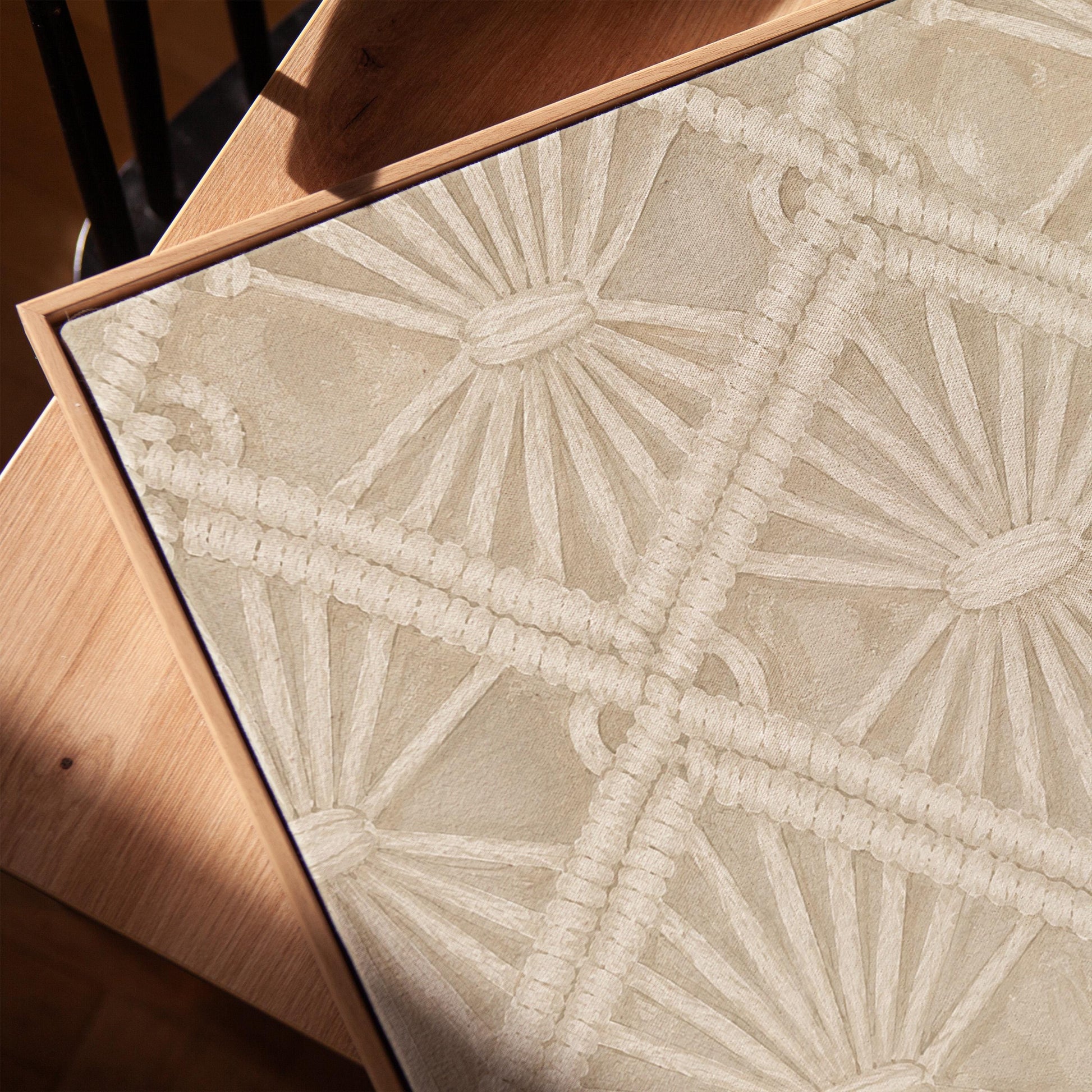 Diamond and fan lace pattern in ivory tones, canvas print in a warm, minimally styled interior