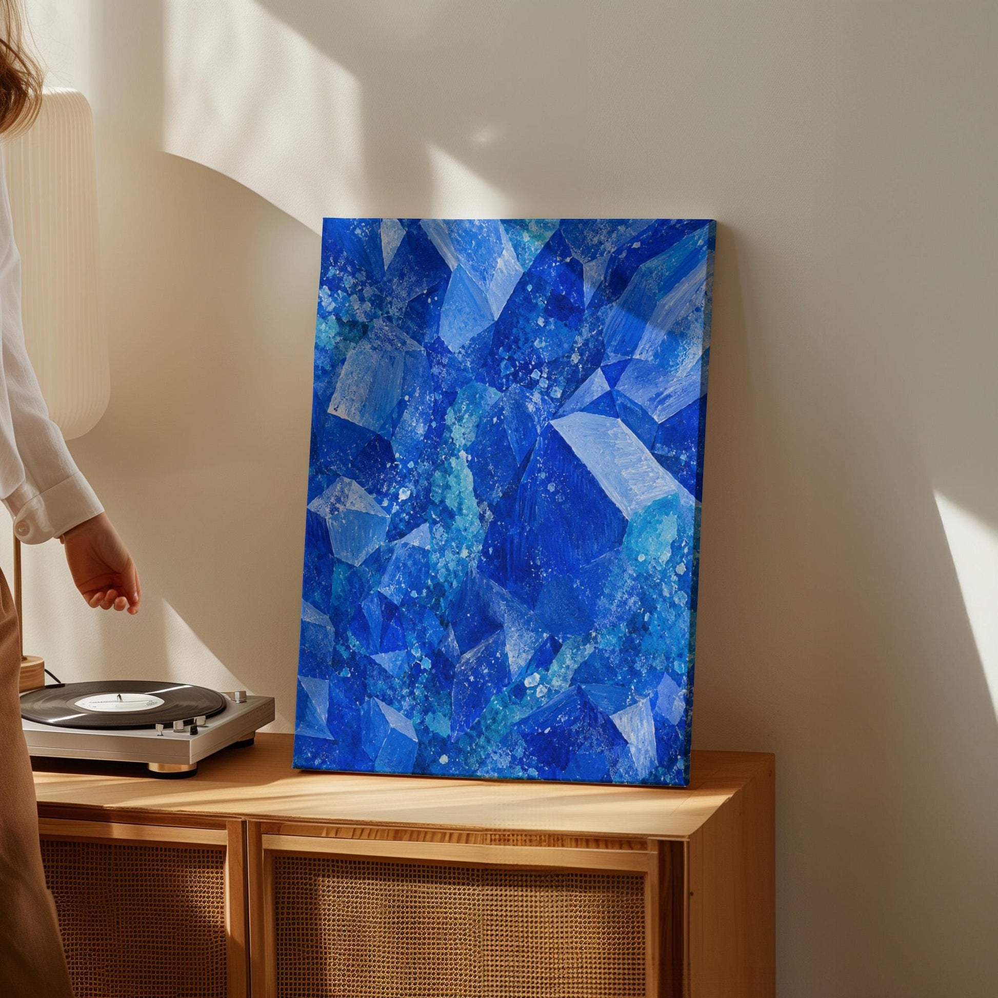 Faceted sapphire crystal planes with turquoise sparks, canvas wall art styled against a soft white wall