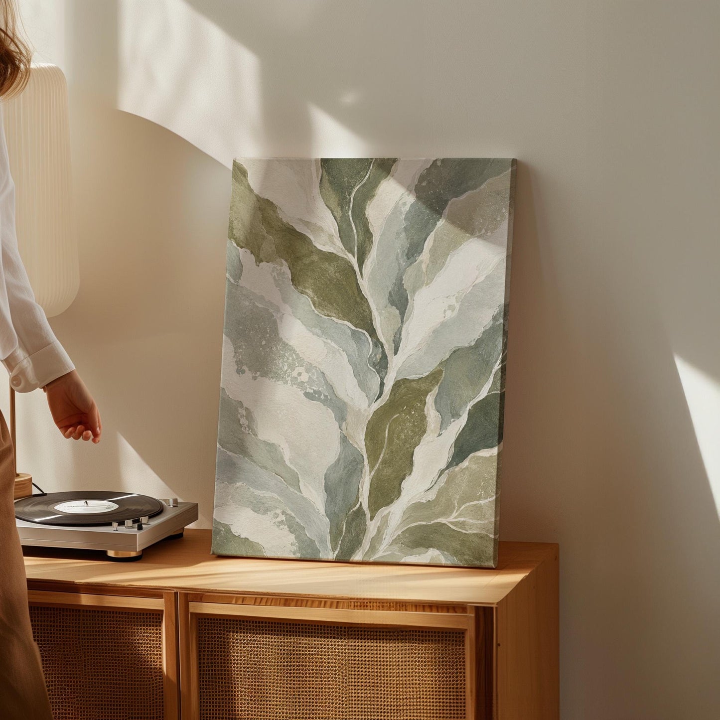 Flowing olive green leaves with soft marbled look, canvas print styled against a soft white wall