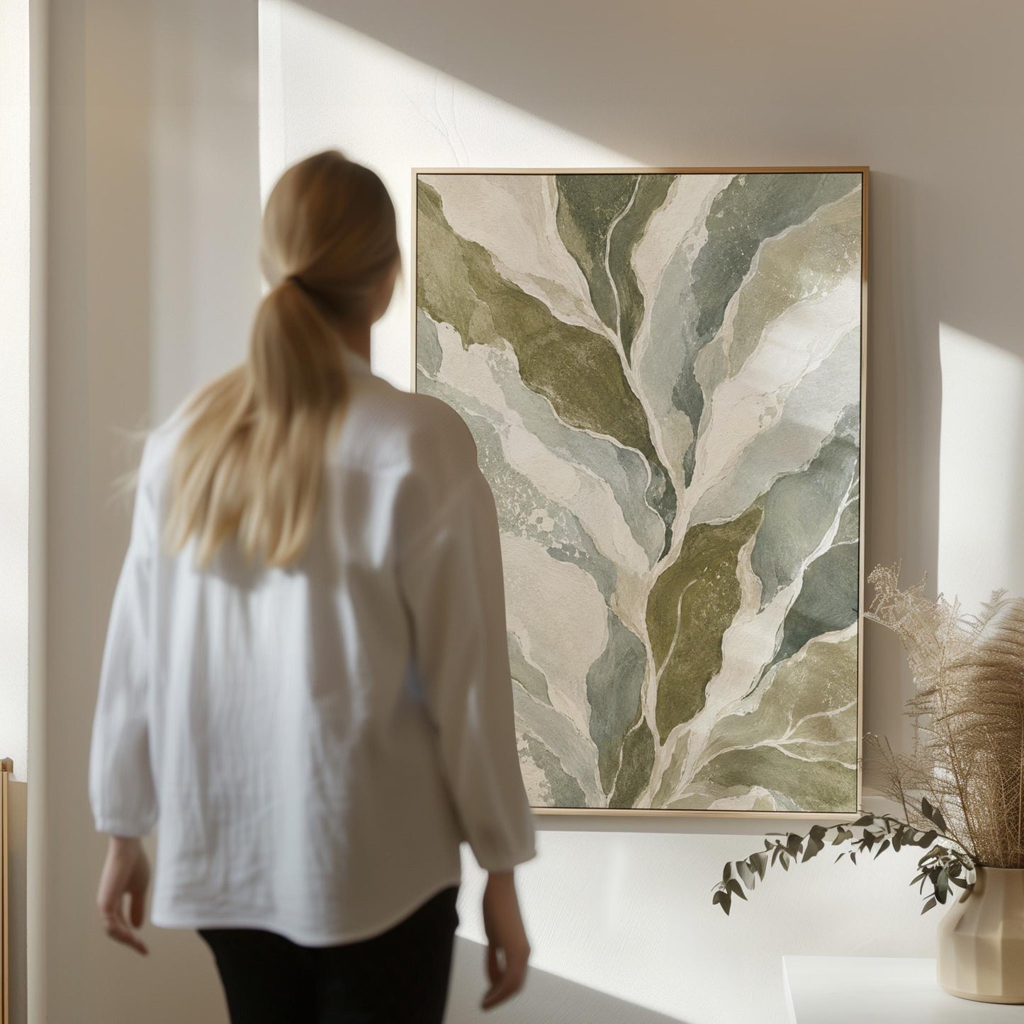 Flowing olive green leaves with soft marbled look, canvas wall art styled against a soft white wall