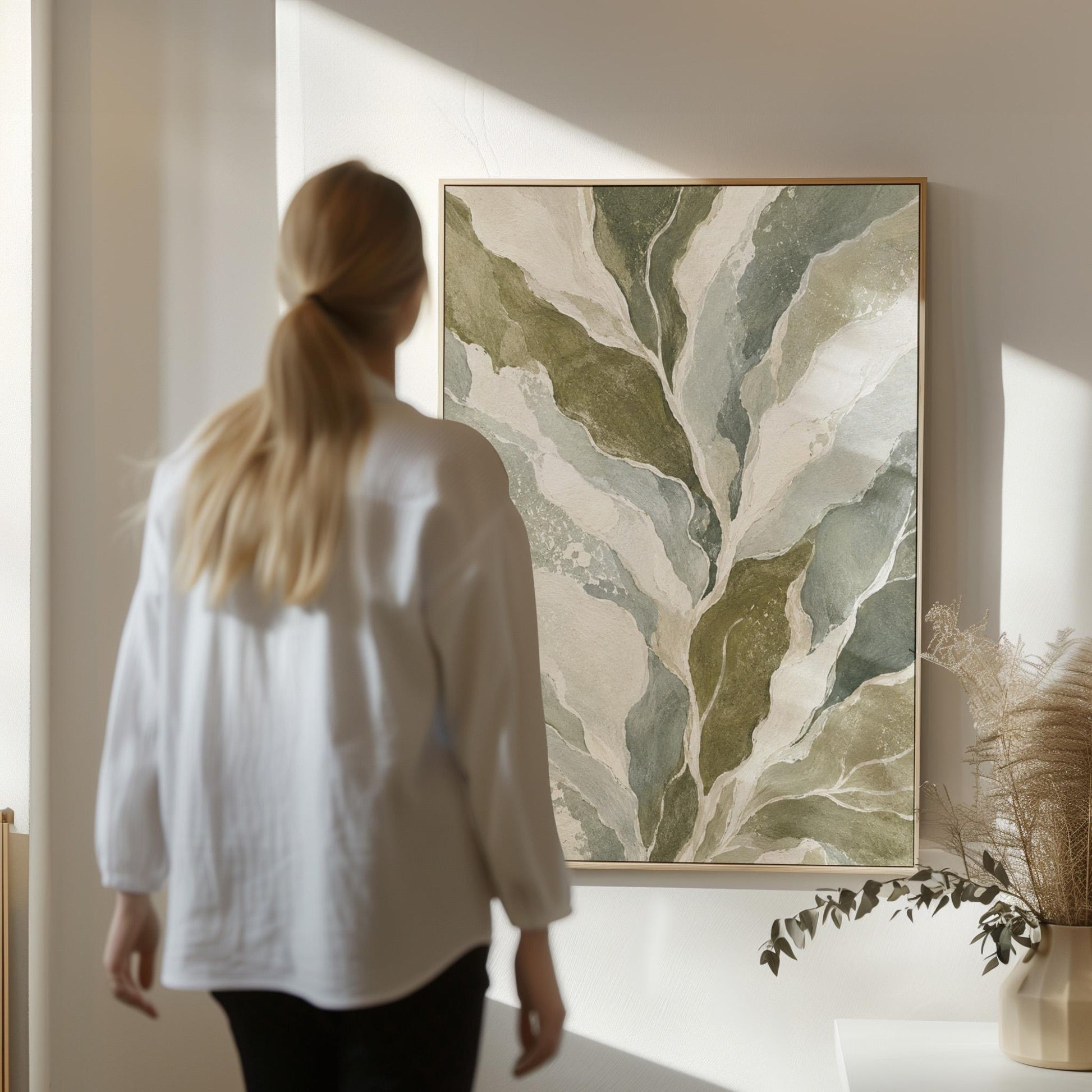 Flowing olive green leaves with soft marbled look, canvas wall art styled against a soft white wall