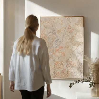 Fine sprigs and tiny blooms scattered on cream, canvas wall art presented in a light, minimal room