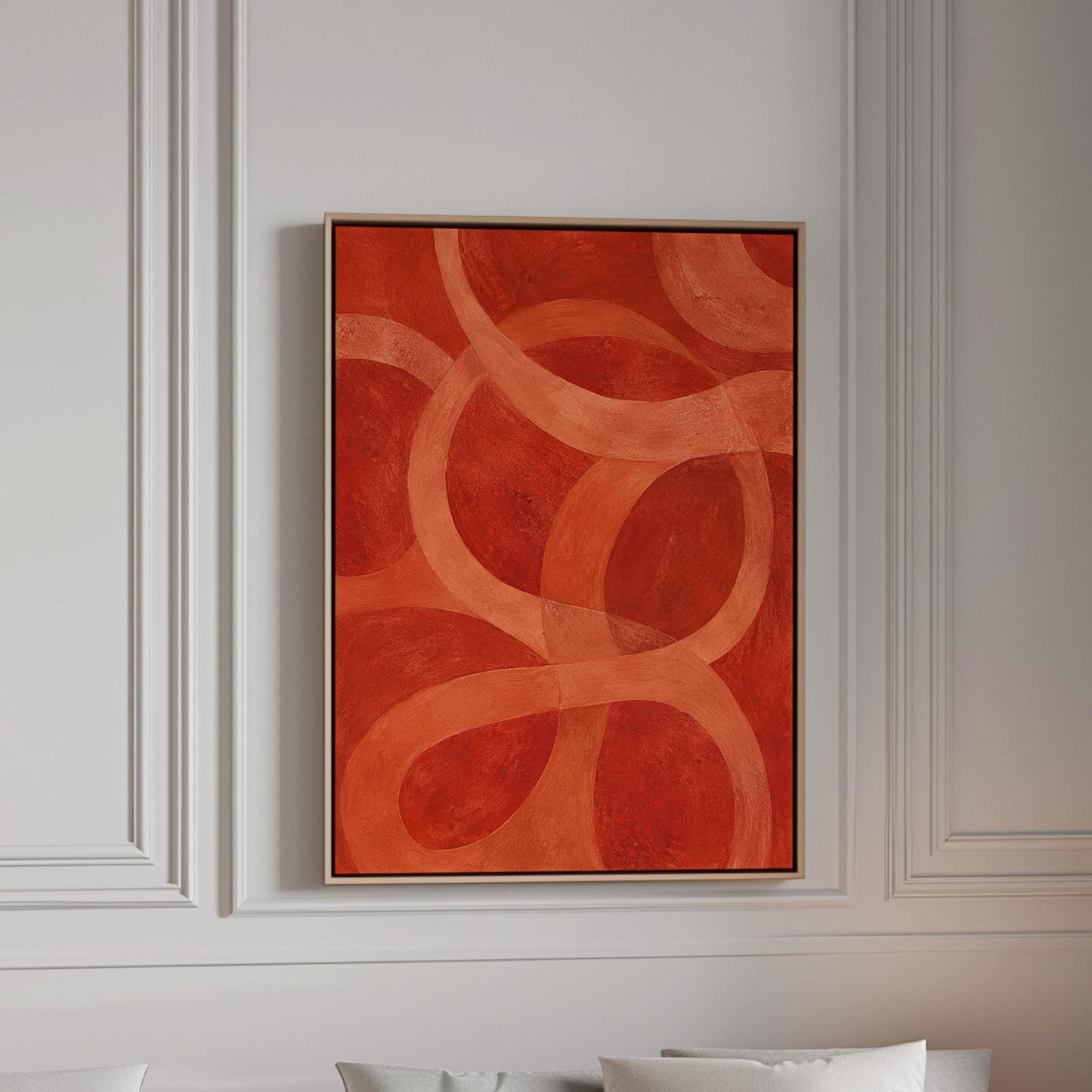 Interlocking loop rings in burnt orange and rust, canvas print in a bright room with natural daylight