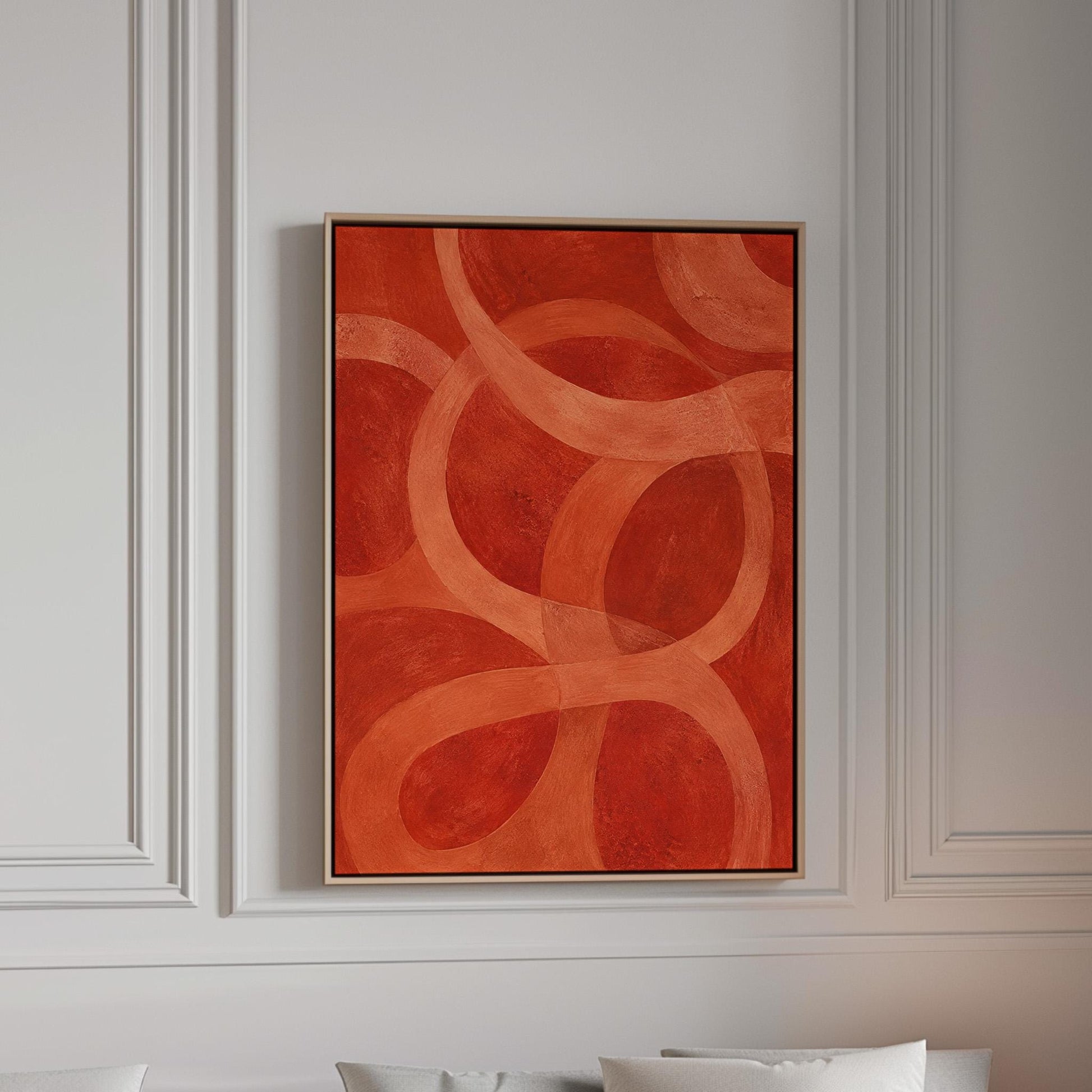 Interlocking loop rings in burnt orange and rust, canvas print in a bright room with natural daylight