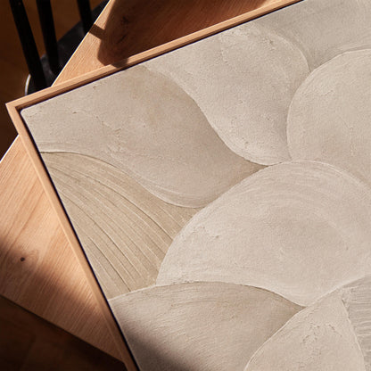 Sweeping layered petal curves in cream tones, canvas print in a warm, minimally styled interior