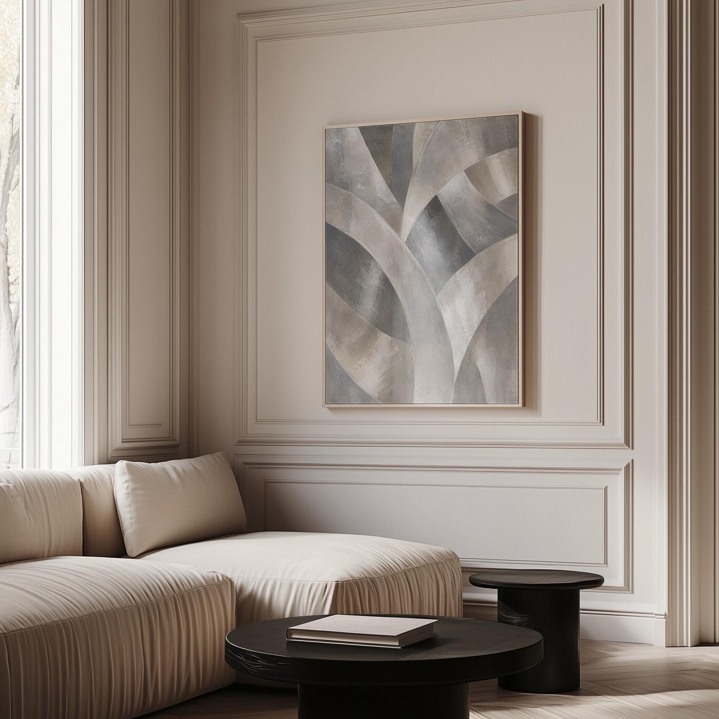 Crossing curved silver bands in graceful motion, canvas print shown to scale in a furnished room