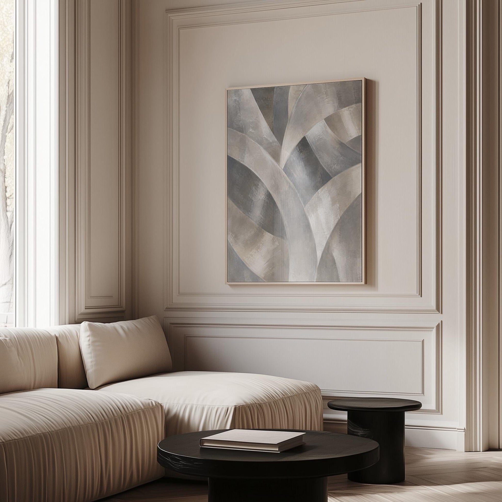 Crossing curved silver bands in graceful motion, canvas print shown to scale in a furnished room
