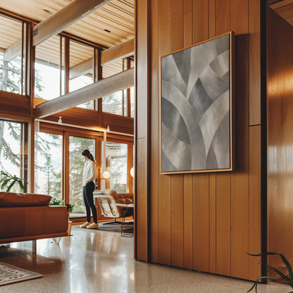 Crossing curved silver bands in graceful motion, canvas wall art presented in a light, minimal room