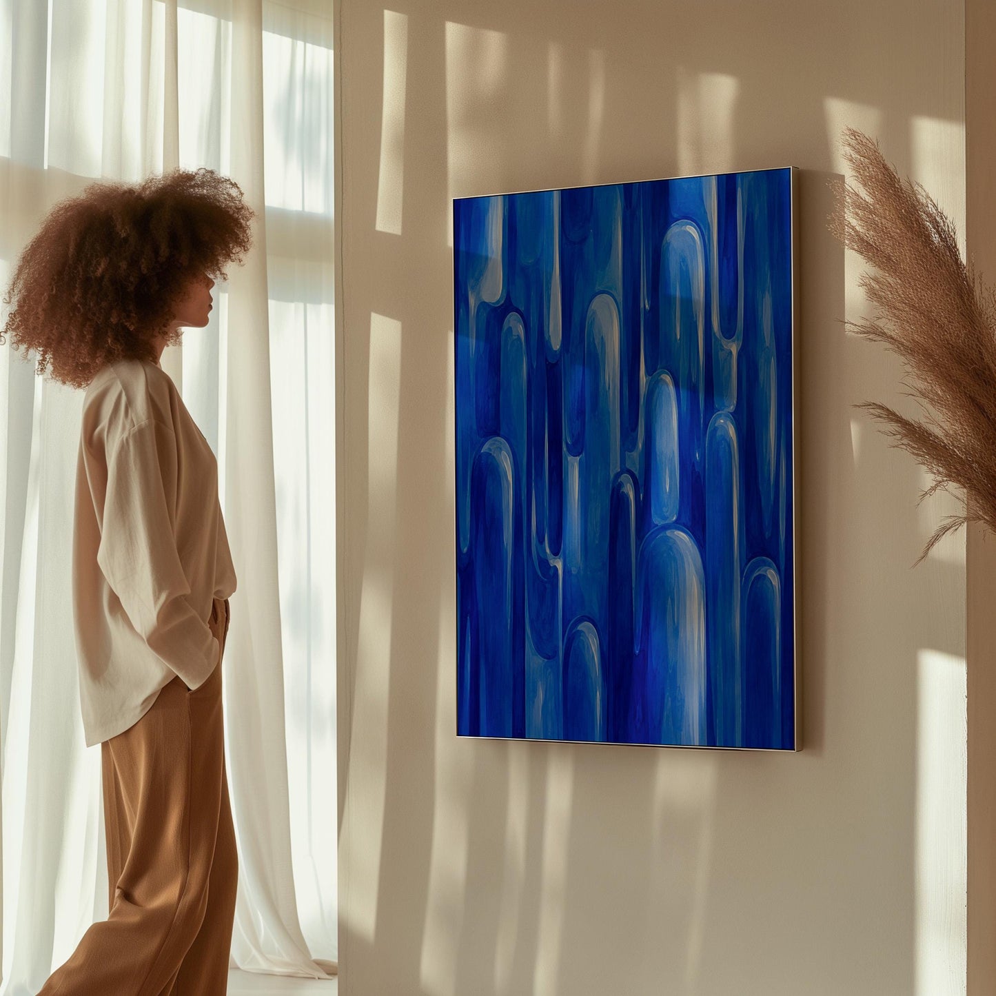Vertical cobalt streaks like flowing rain, canvas print on a quiet wall in a considered interior