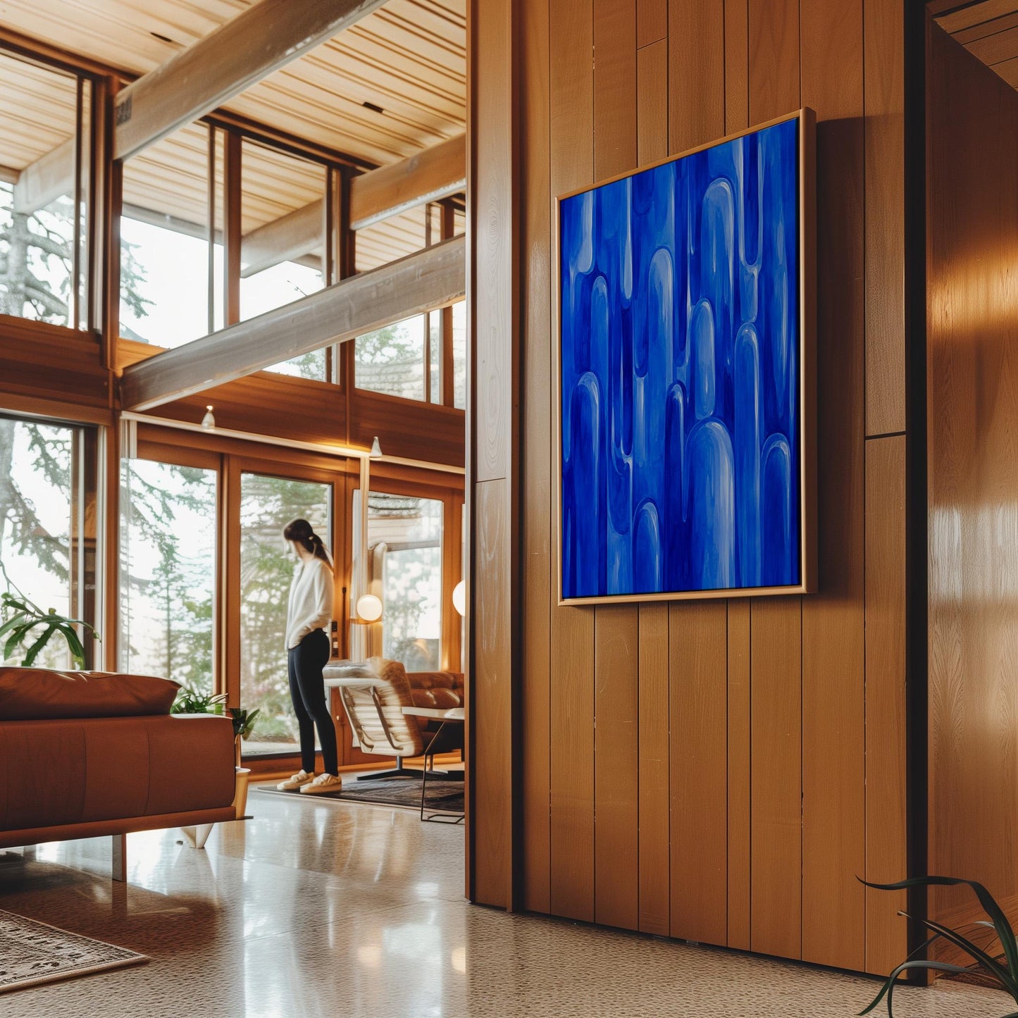 Vertical cobalt streaks like flowing rain, canvas wall art presented in a light, minimal room