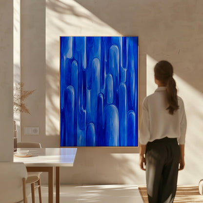 Vertical cobalt streaks like flowing rain, canvas wall art on a quiet wall in a considered interior