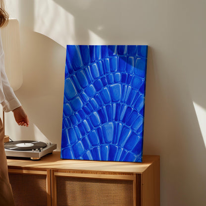 Fan arcs of cobalt mosaic pebbles, canvas print shown to scale in a furnished room