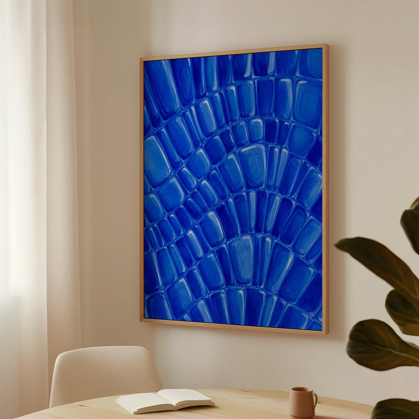Fan arcs of cobalt mosaic pebbles, canvas wall art seen in a warm interior with natural light