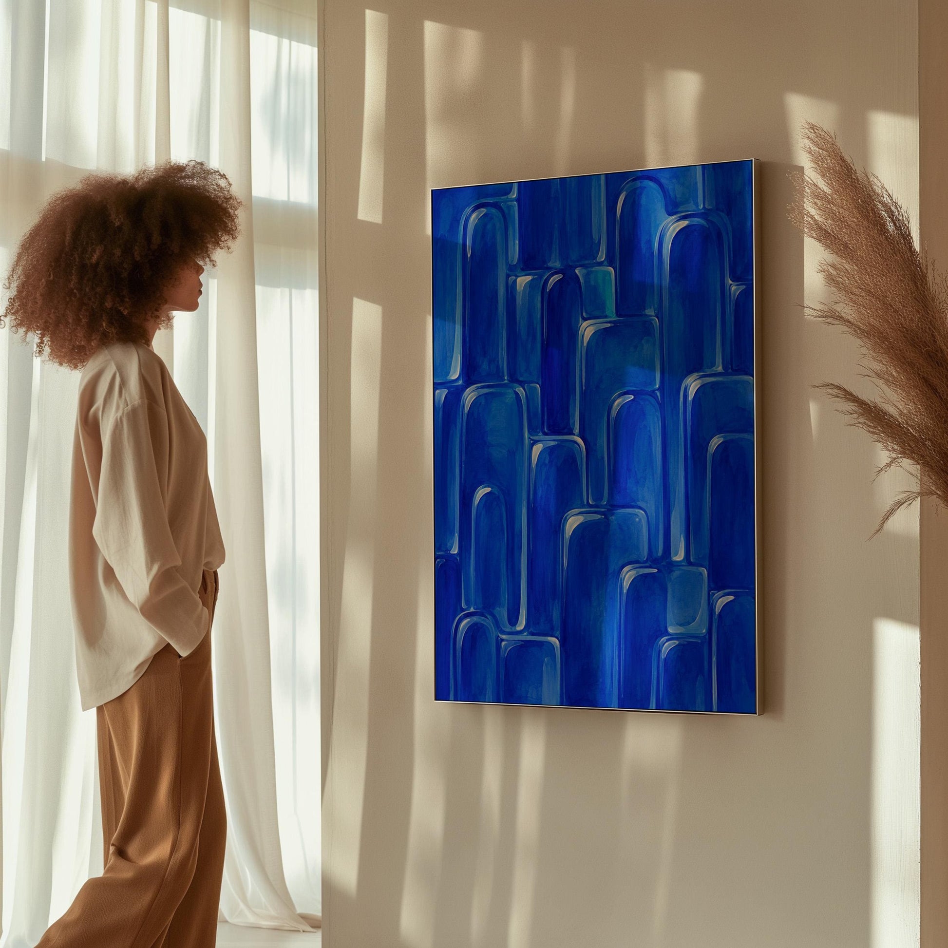 Rounded arch tile shapes in vivid cobalt blue, canvas print presented in a light, minimal room