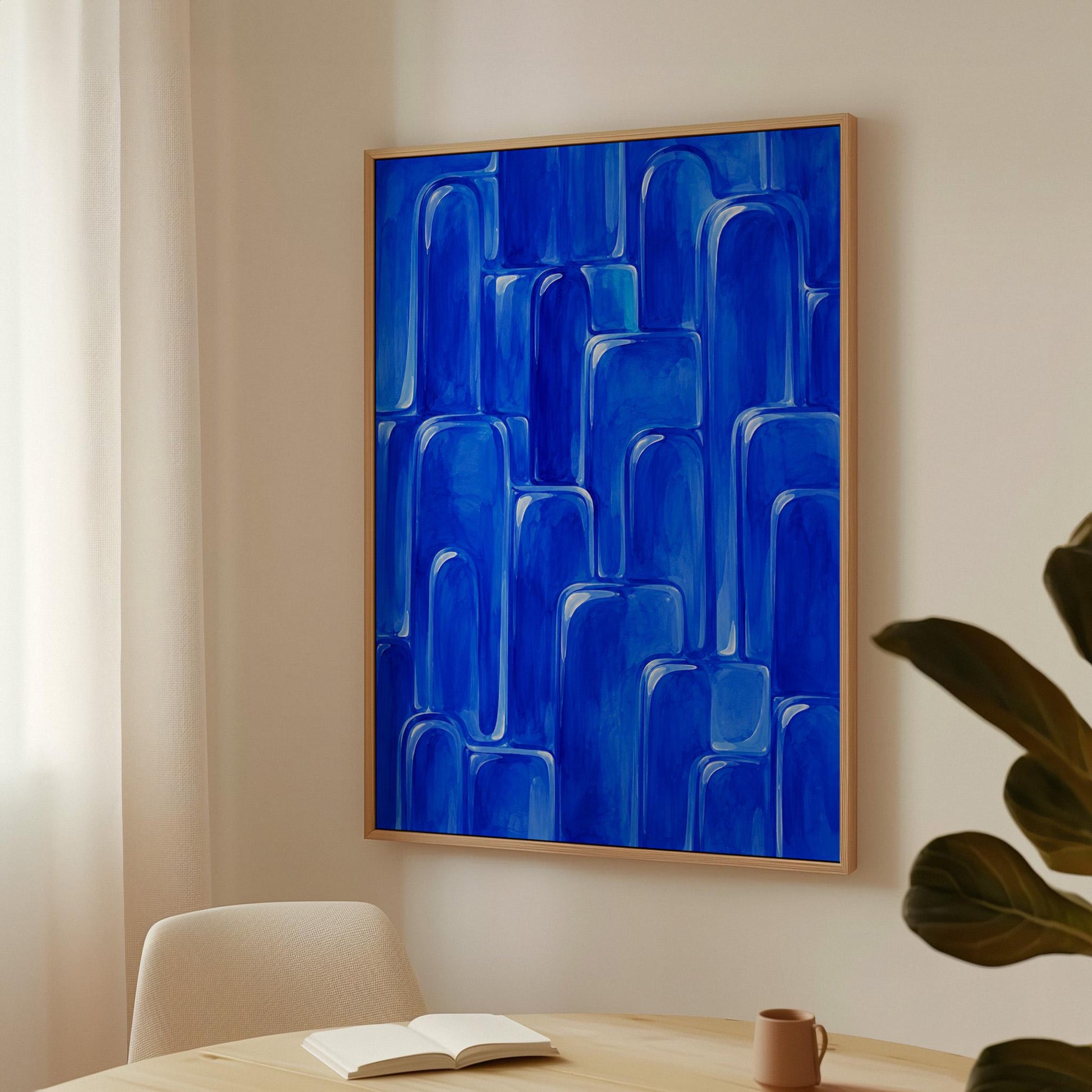 Rounded arch tile shapes in vivid cobalt blue, canvas wall art seen in a warm interior with natural light