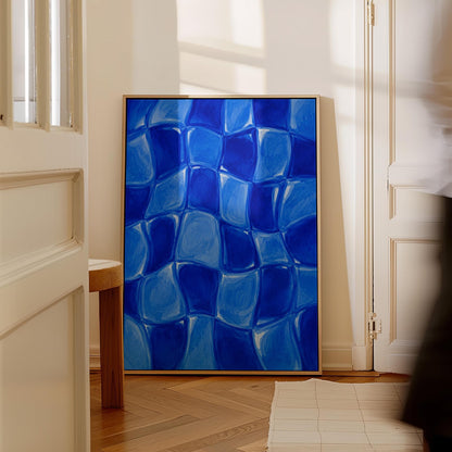 Wavy checkered squares in deep cobalt blue, canvas print displayed on a neutral wall in a styled interior