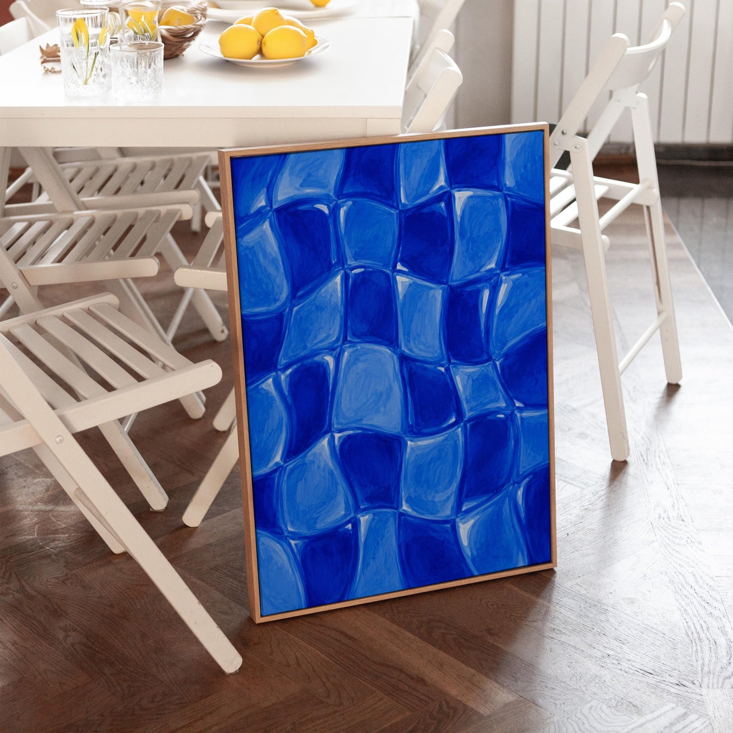 Wavy checkered squares in deep cobalt blue, canvas wall art seen in a warm interior with natural light