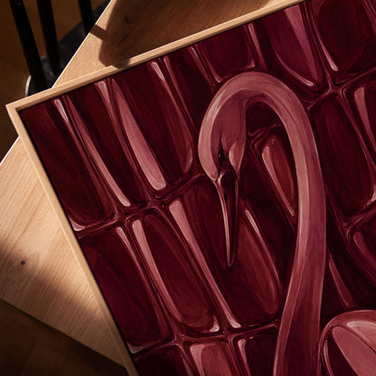 Flamingo silhouette emerging from deep burgundy, canvas print in a warm, minimally styled interior