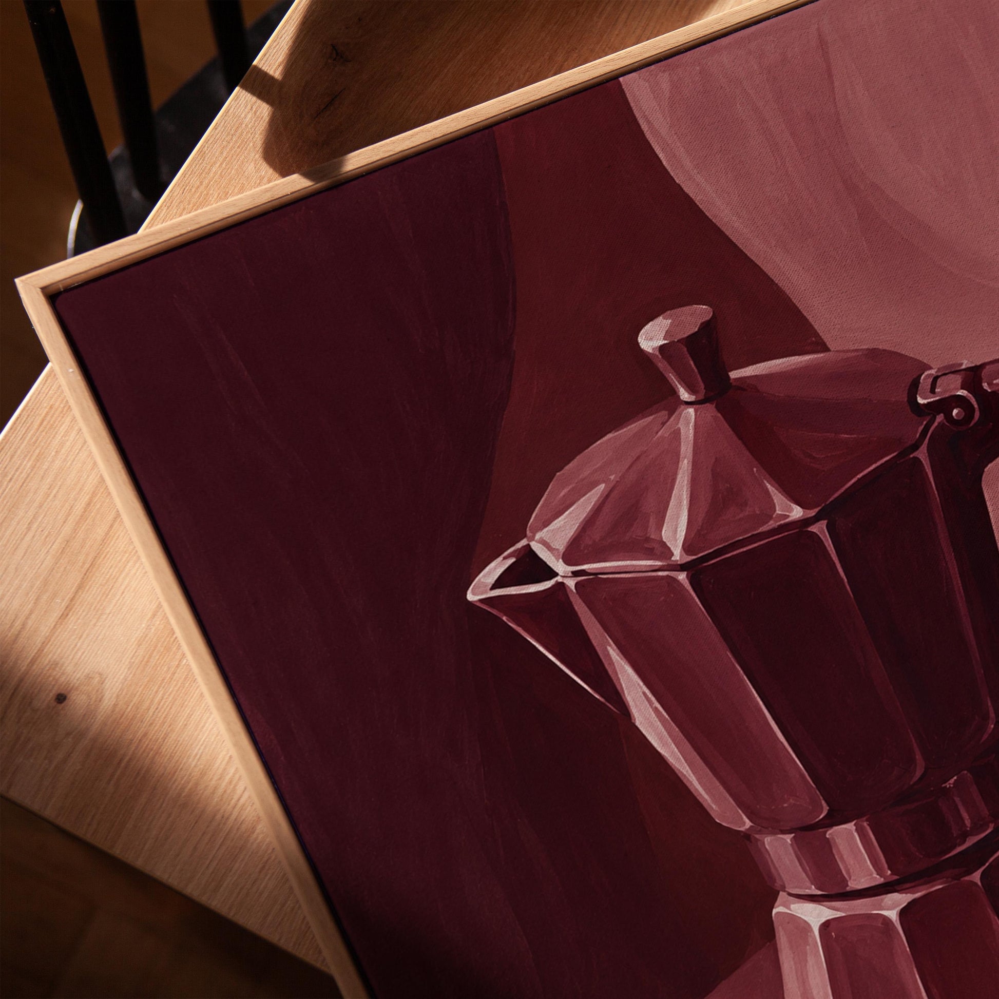 Moka pot and espresso cup still life in burgundy monochrome, canvas print in a warm, minimally styled interior