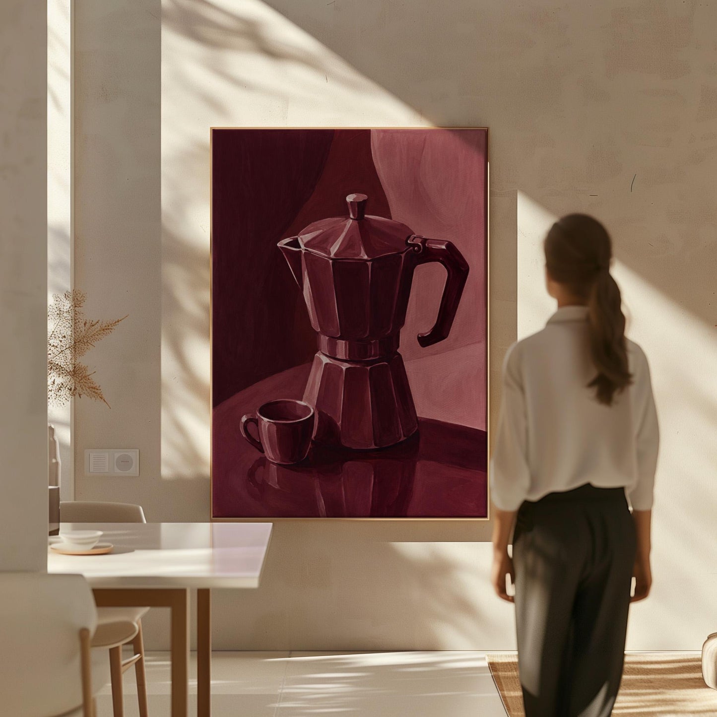 Moka pot and espresso cup still life in burgundy monochrome, canvas print hanging in a calm, modern living space