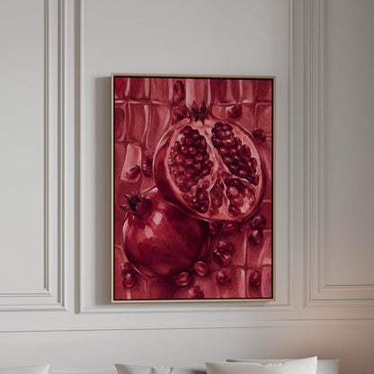 Open pomegranate with ruby seeds in burgundy tones, canvas print in a bright room with natural daylight