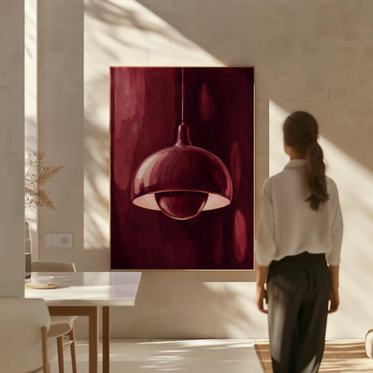 Pendant lamp glowing warmly against burgundy darkness, canvas wall art hanging in a calm, modern living space