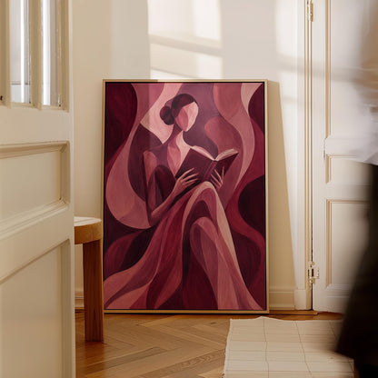 Woman reading a book among flowing burgundy drapes, canvas print presented in a light, minimal room